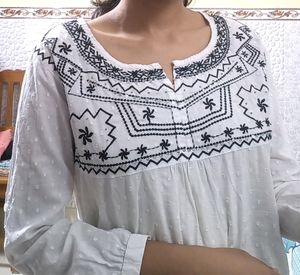 Pure Cotton, White Kurti From The Brand DJ&amp; C.It Has Black Thread Work With Silver Sequins Work.