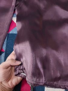 Elegant Purple Satin Garment with White Flower