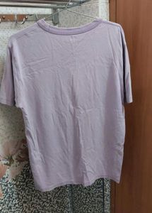 Uniqlo Solid Women Round Purple T Shirt