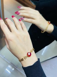Elegant Gold-Tone & Red Bracelet