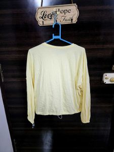 Yellow Long Sleeve Top with elastic at the bottom.