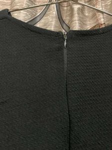 Sleeveless Peplum Top