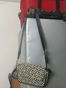 New Tagged Sling Bag  With A Coin Pouch