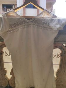 A White Short Kurti With Straight Pent