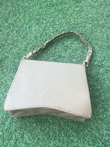 Elegant Clutch with Peacock Detail