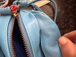 Hidesign sling with leather charm n dust bag