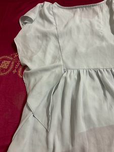 light blue frilled top