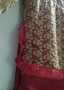 Maroon Satine Long Gown With Golden Net.