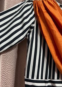 Bold Striped Jumpsuit with Statement Orange Detail
