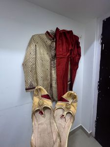 gold and maroon sherwani with shoes