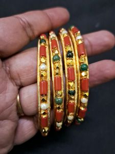 Beautiful coral and gold bangles Sz 2.8