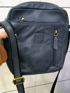 Good condition crossbody blue leather bag.