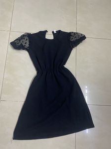 Chic Black Dress with Polka Dot Sleeves