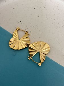 Heartbeat Radiance - Sculpted Gold HeartHoop Earr