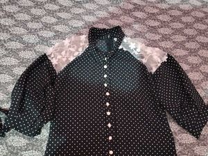 A Black Polyster Top With White Dots Nd Classic .