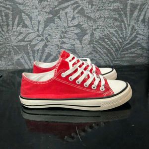 Red Low-Top Canvas Sneakers.