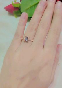 Elegant rose gold ring with a lavender stone.