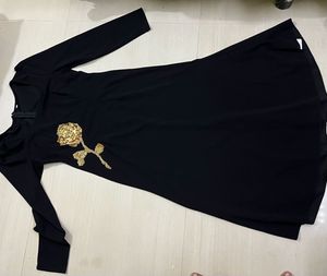 Black Dress with Gold Rose Detail