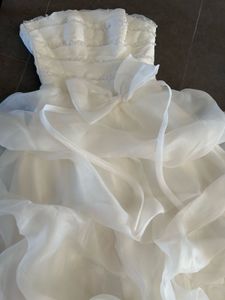VOLUMINOUS RUFFLED ORGANZA WEDDING GOWN