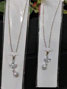 Elegant Pearl & Crystal Pendant Necklace
