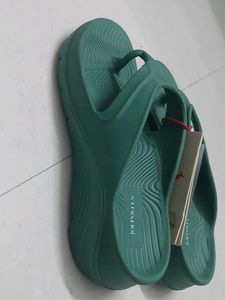 Branded Green flip-flops