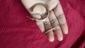 Gold decorative hoop Earrings.