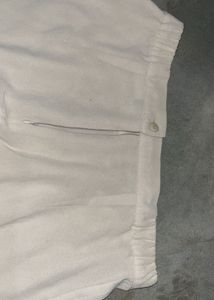 Beige Wide-Leg Sheer Overlay Trousers.