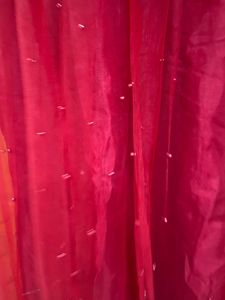 red net gown with pearls