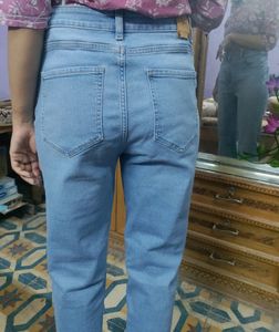 full length flared blue jeans