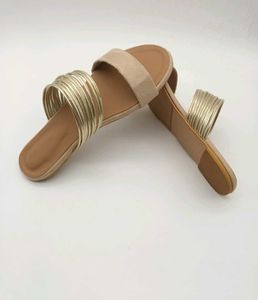 Tan And Gold Flat Sandals.