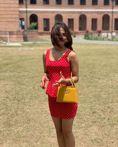 red dress with Polka Dot Handbag both