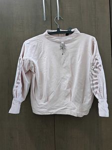 Elegant Blush Top with Lace Sleeves