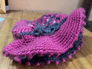 Handmade Crocheted Hat with Floral Embellishment