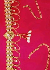 Gold tone headpiece
