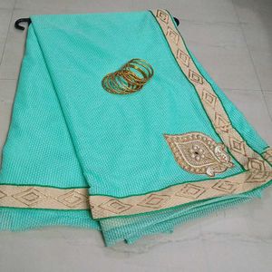 Elegant Teal Saree with Gold Embroidery