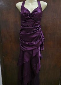 Purple ruffle dress with tailing on left side.