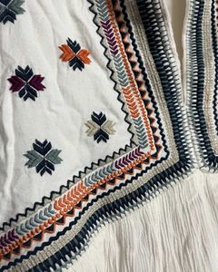 White Boho A Line dress with colourful embroidery.