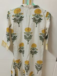 White Kurti with flower design. Can Be worn as shrug also. Length - 46in.