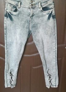 light grey, acid-wash or faded jeans.