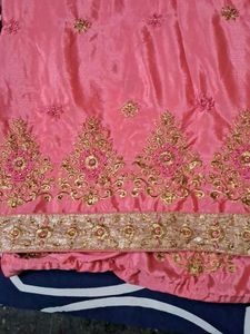 It Is Pink Color Georget With Golden Net Border .