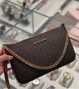 Michael Kors Clutch/ sling bags