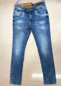 Toned Distressed Blue Jeans