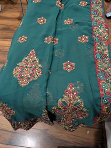 Elegant Green Sari with Intricate Embroidery