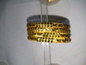 Gold-toned Bangle Set (4)