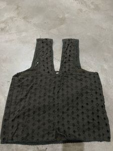 eyelet top or blouse with wide, ruffled Straps
