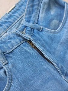 Mid Rise Ripped Denim Jeans