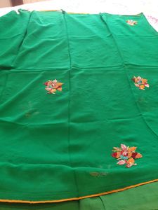 Pure georgette saree in green color  embroidered flower  ?