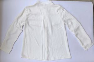 White shirt with red scallop detailing