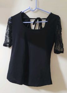 Black Top With Sheer Sleeves And Back Knot