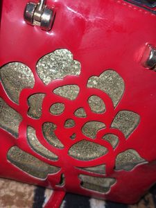 Red Handbag with Floral Detail